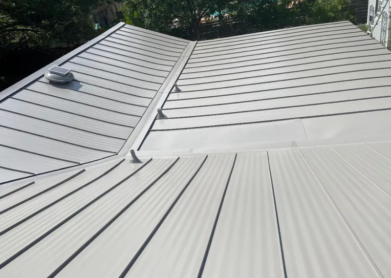 Solar attic fan installed on a metal roof for Roof Ventilation in Tifton